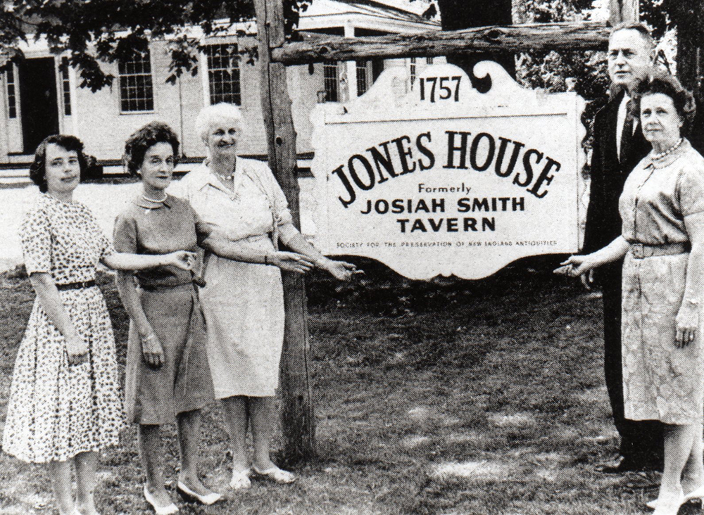 Founding members of Weston History Society standing by sign of Jones House (Josiah Smith Tavern)