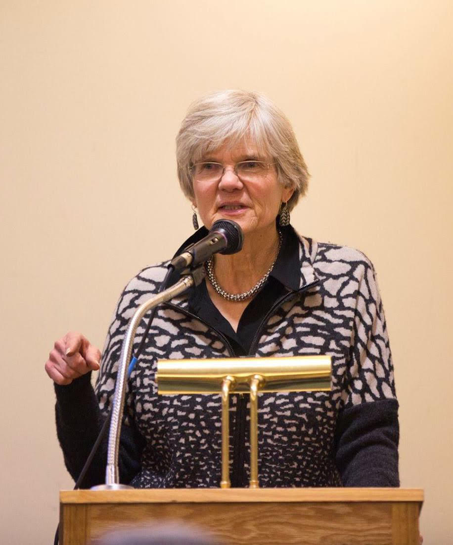 Pam Fox speaking at lectern