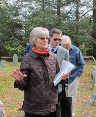 Pam Fox speaking to attendees on cemetery tour.