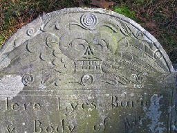 Winged skull carving